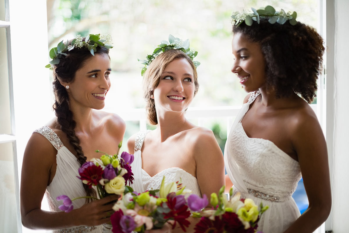 bride-and-bridesmaids-standing-with-bouquet-WUP98TF.jpg